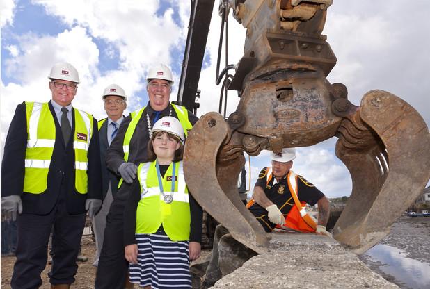Cornwall councillors John Pollard and John Coombe joined Hayle mayor Graham Coad and mayor's  consort Lizzie Coad to see the work completed at the breach in South Quay